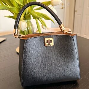 Kate Spade Black Mini Bag with Gold Hardware and Structured Design
